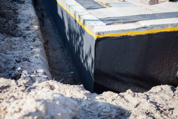 Professional Basement Waterproofing technician working in Staunton, IL